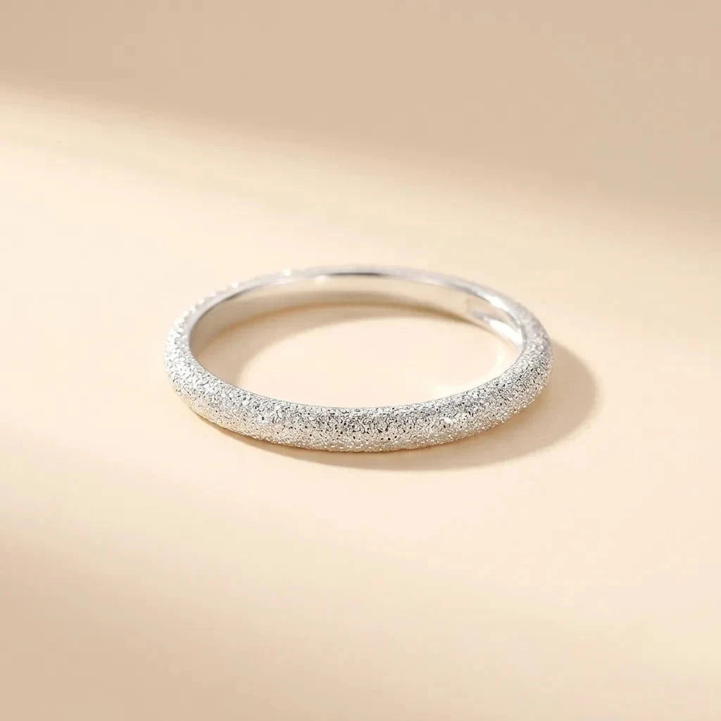 Glistening sand-textured thin S925 sterling silver band ring by Maadin Artistry