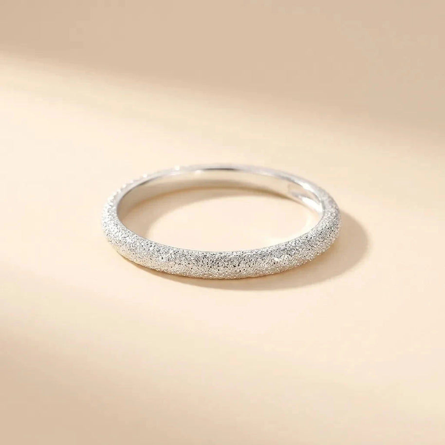 Glistening sand-textured thin S925 sterling silver band ring by Maadin Artistry