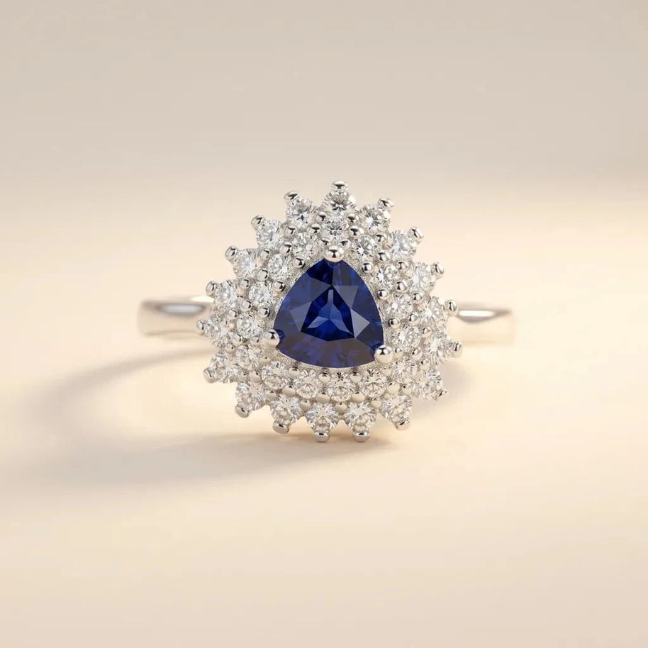 Trillion Cut ring with a blue trillion-cut stone in a double sunburst halo, S925 sterling silver by Maadin Artistry