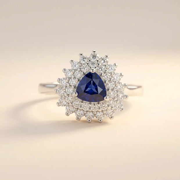 Trillion Cut ring with a blue trillion-cut stone in a double sunburst halo, S925 sterling silver by Maadin Artistry