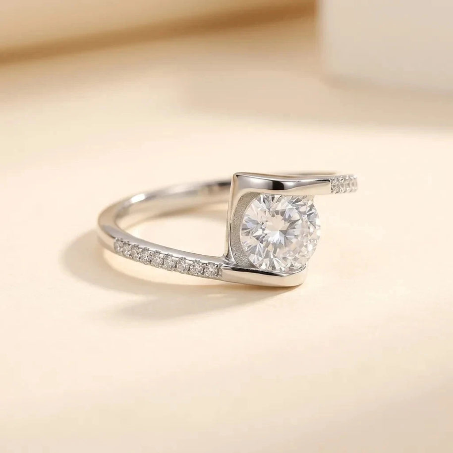 Twist bypass S925 sterling silver ring with a square-set stone and pavé band by Maadin Artistry
