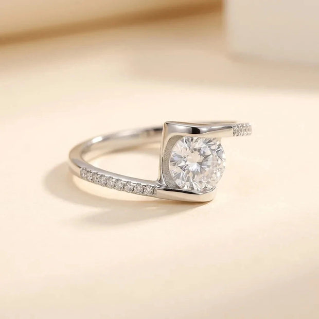 Twist bypass S925 sterling silver ring with a square-set stone and pavé band by Maadin Artistry