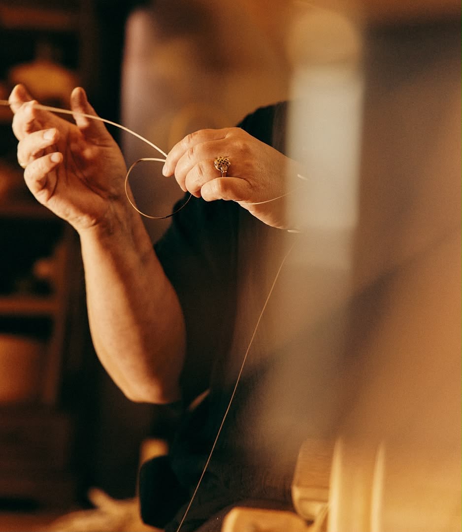 Shaping silver wire by hand for a Maadin Artistry ring